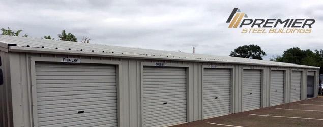 A long grey building with Premier Steel's logo in the top-right corner